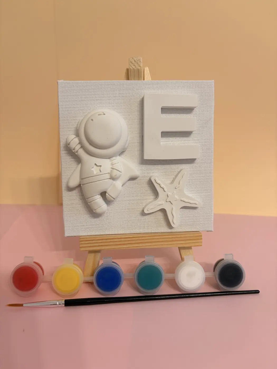 A personalized plaster canvas kit with a wooden easel, six paint pots and a brush. Photo 1 of 13.