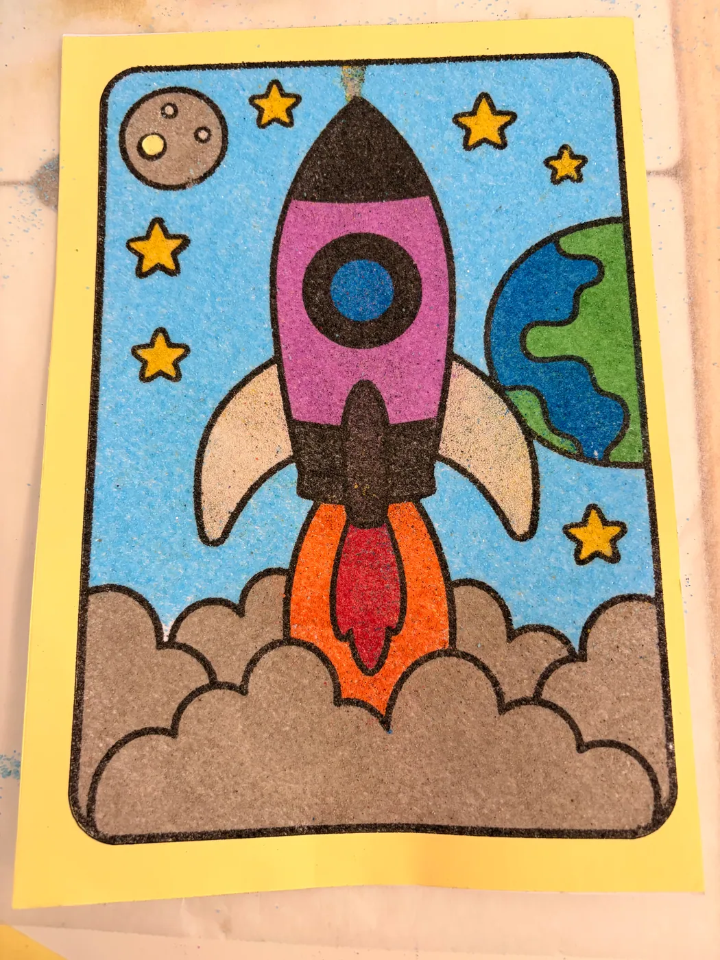 Sand art photo: A rocket ready for lift-off.